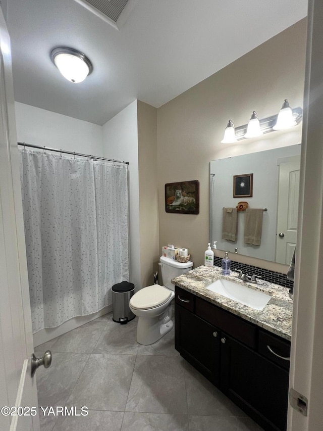 522 Adobe Way, Selah, WA 98942 - full bath with toilet, vanity, tile patterned flooring, and shower / bath combo with shower curtain