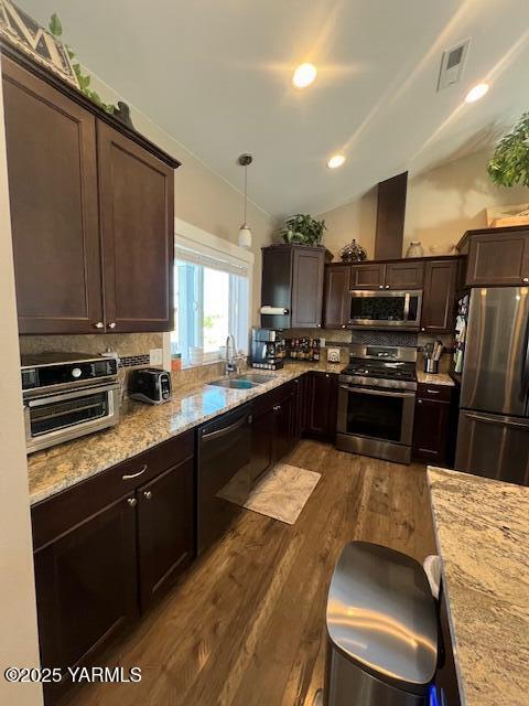 522 Adobe Way, Selah, WA 98942 - kitchen with appliances with stainless steel finishes, a sink, dark wood finished floors, dark brown cabinetry, and lofted ceiling