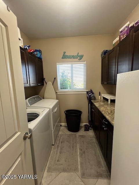 522 Adobe Way, Selah, WA 98942 - laundry room featuring cabinet space, washing machine and clothes dryer, light tile patterned floors, and baseboards