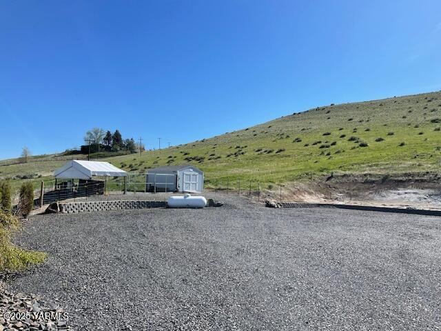 522 Adobe Way, Selah, WA 98942 - view of yard featuring an outbuilding, a shed, and a view of countryside