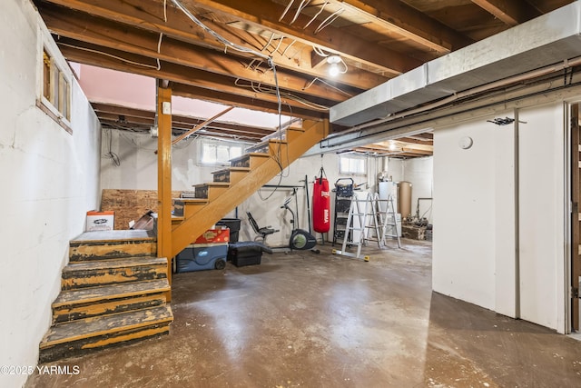 basement with stairway and gas water heater
