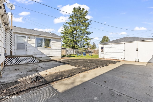 garage with fence