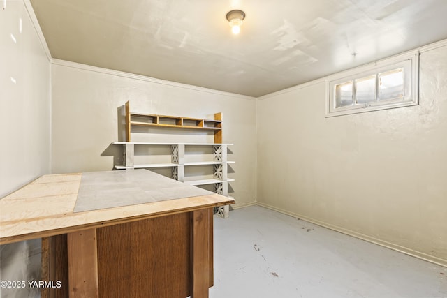 home office with concrete flooring and baseboards