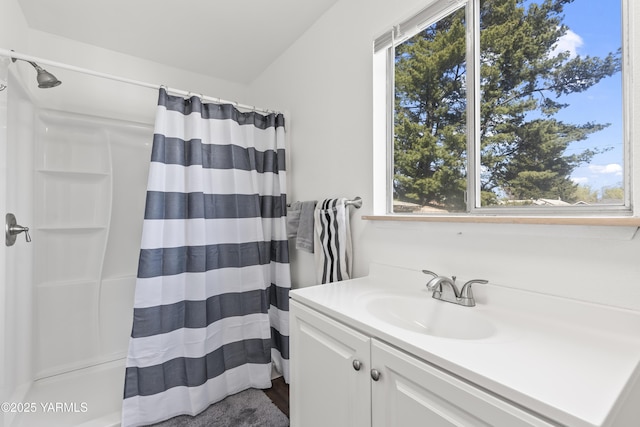 bathroom featuring wood finished floors, curtained shower, a wealth of natural light, and vanity