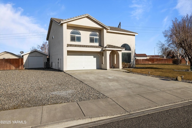 traditional-style home featuring central AC unit, fence, driveway, a tiled roof, and stucco siding