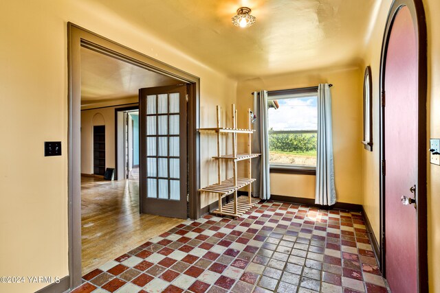 doorway with baseboards