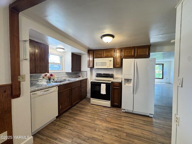 3803 Tieton Dr, Yakima, WA 98902 - kitchen with white appliances, dark wood finished floors, a sink, and dark brown cabinetry