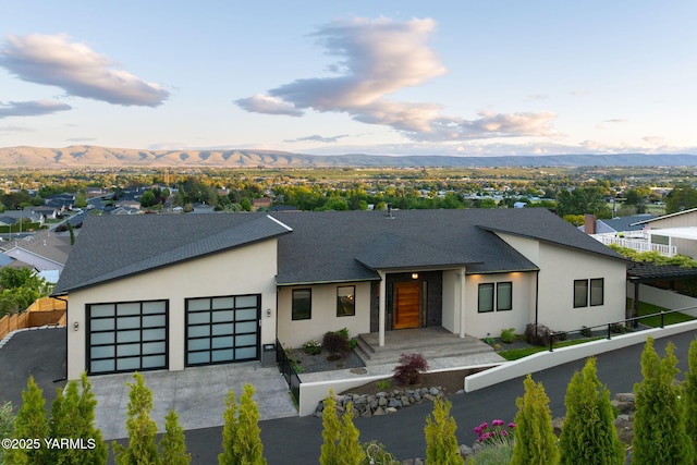 7902 Poplar View Way, Yakima, WA 98908 - contemporary house with a garage, a mountain view, stucco siding, and asphalt driveway