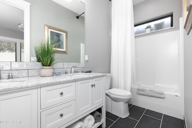 7902 Poplar View Way, Yakima, WA 98908 - bathroom featuring toilet, tile patterned floors, double vanity, and shower / bath combo with shower curtain