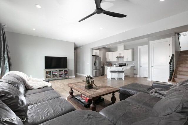 7902 Poplar View Way, Yakima, WA 98908 - living room featuring stairs, ceiling fan, baseboards, recessed lighting, and light wood-type flooring