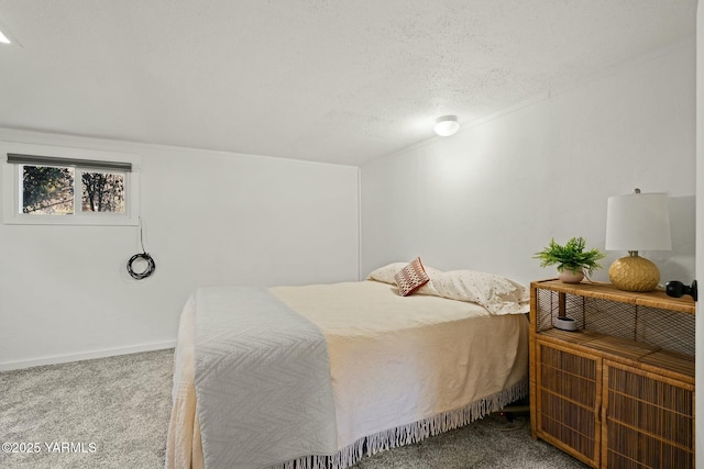 bedroom featuring carpet flooring, baseboards, and a textured ceiling