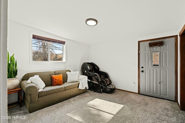 living area featuring baseboards and carpet