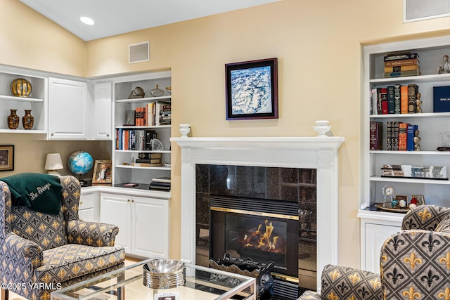 7200 W Lincoln Ave, Yakima, WA 98908 - living room with a tiled fireplace, built in features, and visible vents