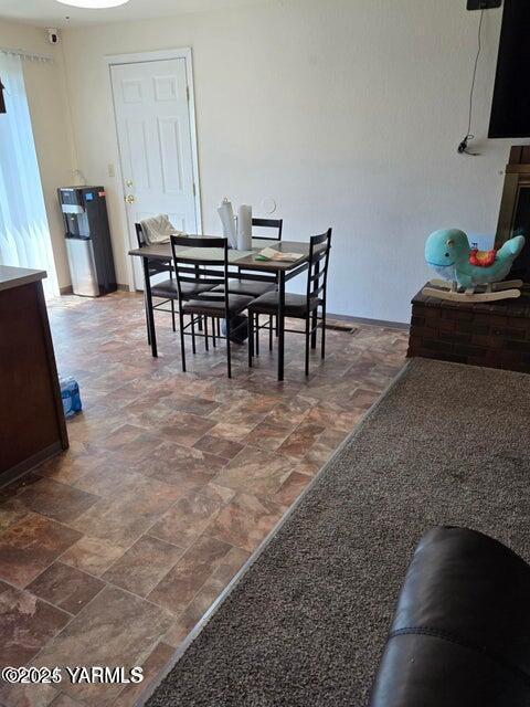 dining room featuring stone finish flooring