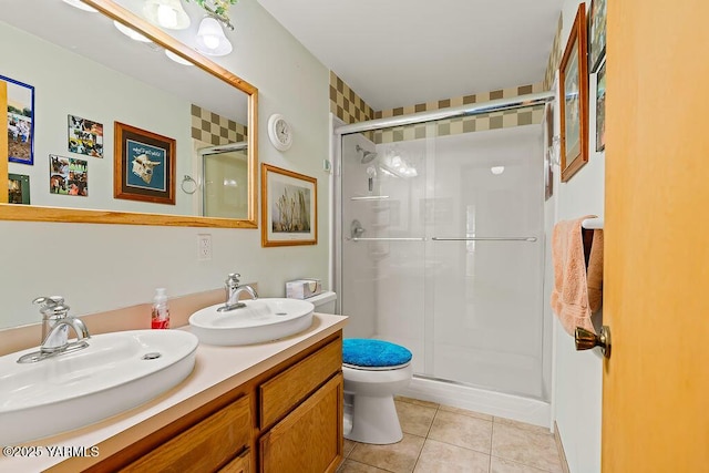 2810 S 79th Ave, Yakima, WA 98903 - full bath featuring a stall shower, double vanity, and tile patterned floors