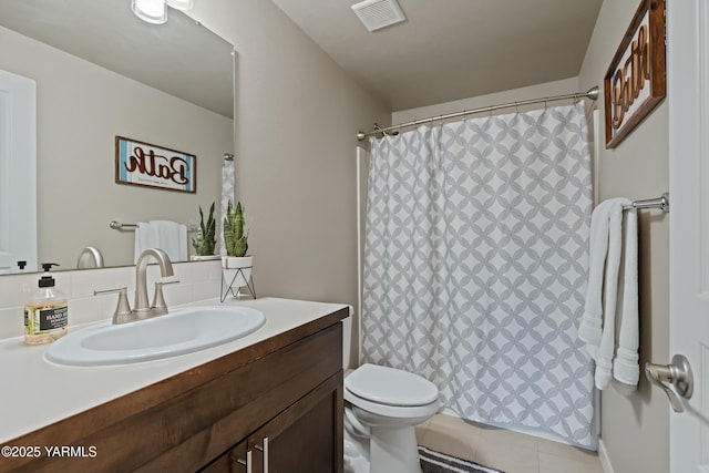 full bathroom with visible vents, toilet, tile patterned floors, vanity, and backsplash