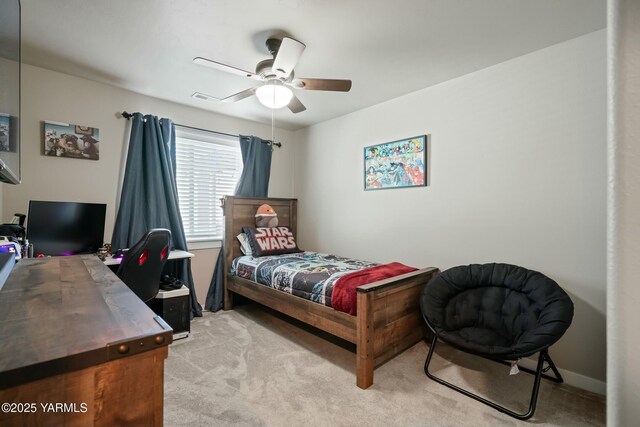 bedroom featuring ceiling fan, visible vents, baseboards, and light colored carpet