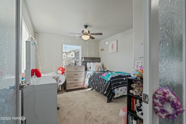 carpeted bedroom with ceiling fan