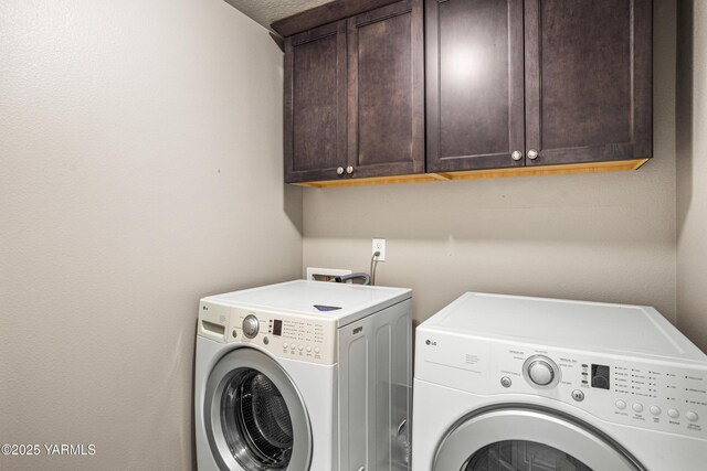 2201 S 62nd Ave, Yakima, WA 98903 - laundry area featuring cabinet space and washer and clothes dryer