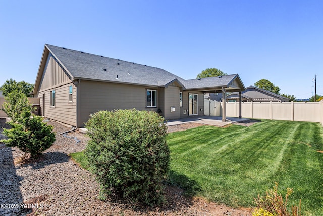 2201 S 62nd Ave, Yakima, WA 98903 - rear view of property with a patio, board and batten siding, and roof with shingles