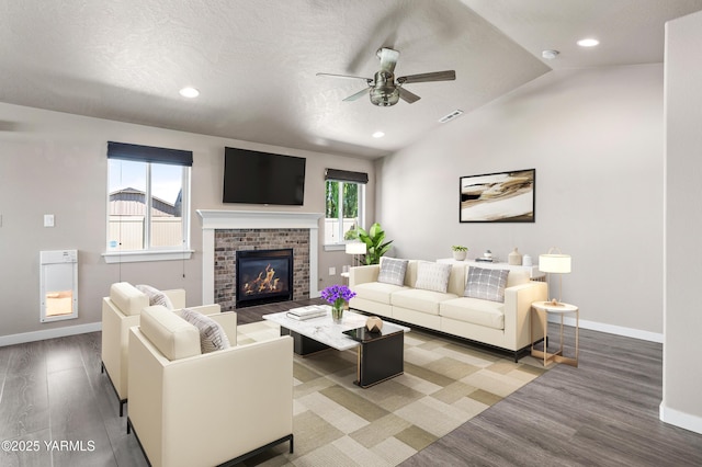 2201 S 62nd Ave, Yakima, WA 98903 - living room featuring a ceiling fan, wood finished floors, baseboards, a fireplace, and recessed lighting