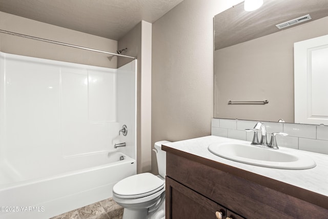 2201 S 62nd Ave, Yakima, WA 98903 - full bathroom with tasteful backsplash, vanity, toilet, and washtub / shower combination