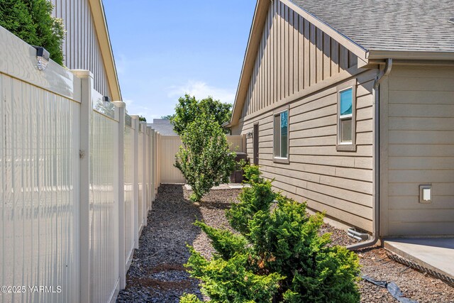 2201 S 62nd Ave, Yakima, WA 98903 - view of property exterior with board and batten siding and roof with shingles