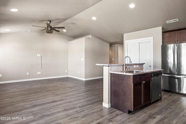 2201 S 62nd Ave, Yakima, WA 98903 - kitchen with appliances with stainless steel finishes, a sink, ceiling fan, baseboards, and light stone counters