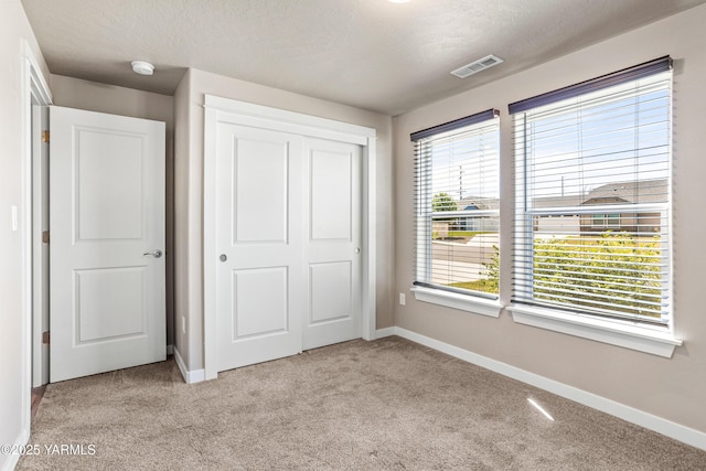 2201 S 62nd Ave, Yakima, WA 98903 - unfurnished bedroom featuring carpet, a closet, and baseboards