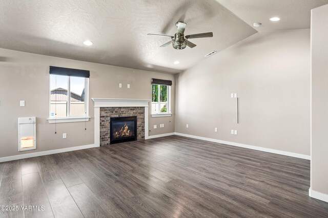 2201 S 62nd Ave, Yakima, WA 98903 - unfurnished living room with a ceiling fan, dark wood finished floors, baseboards, vaulted ceiling, and recessed lighting