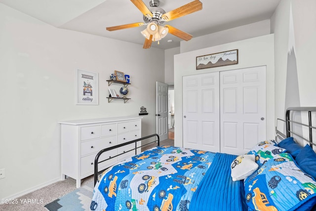 bedroom with a ceiling fan, baseboards, light carpet, and a closet