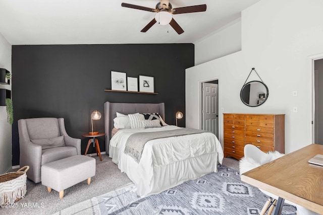 carpeted bedroom featuring ceiling fan and lofted ceiling