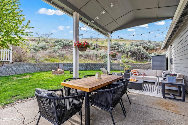 view of patio / terrace featuring an outdoor living space with a fire pit