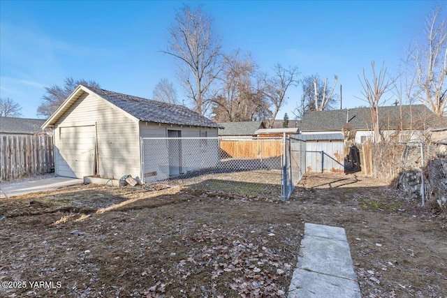 view of yard featuring a fenced backyard and an outbuilding