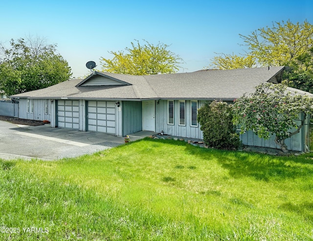 ranch-style house with board and batten siding, driveway, roof with shingles, a garage, and a front lawn