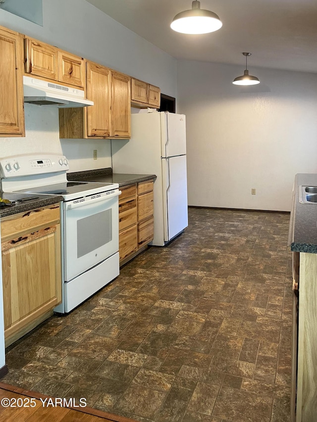 kitchen featuring dark countertops, a sink, white appliances, under cabinet range hood, and pendant lighting
