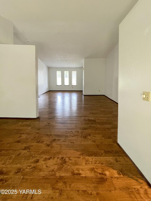 unfurnished room with hardwood / wood-style floors
