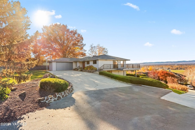 view of front of property featuring a garage and concrete driveway