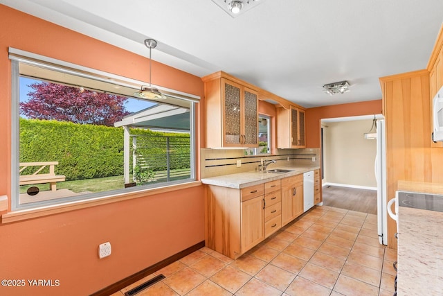 220 N 42nd Ave, Yakima, WA 98908 - kitchen featuring light brown cabinetry, light countertops, visible vents, a sink, and white appliances