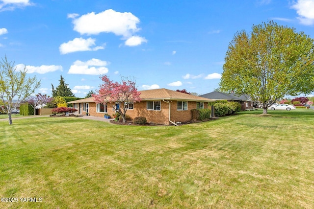 220 N 42nd Ave, Yakima, WA 98908 - rear view of house with a lawn and brick siding
