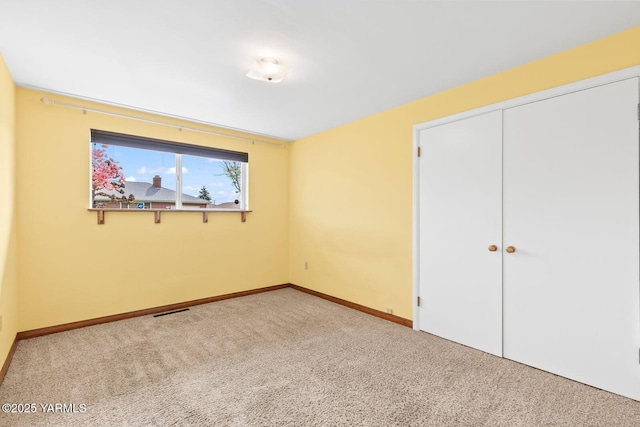 220 N 42nd Ave, Yakima, WA 98908 - unfurnished bedroom featuring a closet, carpet, visible vents, and baseboards