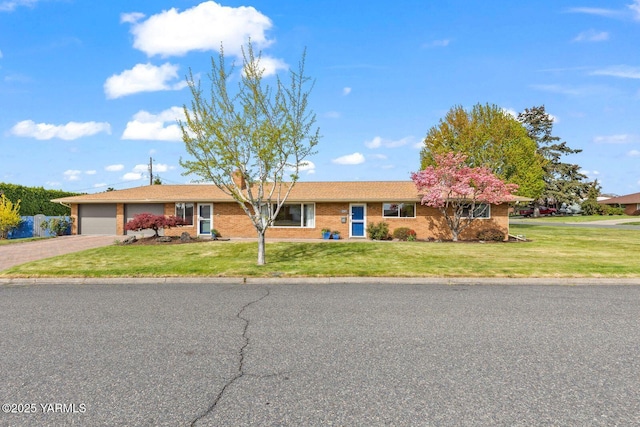 220 N 42nd Ave, Yakima, WA 98908 - single story home with a garage, driveway, a front lawn, and brick siding