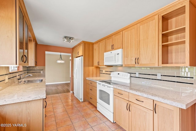 220 N 42nd Ave, Yakima, WA 98908 - kitchen with a sink, decorative backsplash, light brown cabinetry, white appliances, and light tile patterned floors