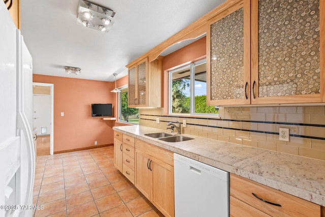 220 N 42nd Ave, Yakima, WA 98908 - kitchen with light brown cabinetry, light tile patterned floors, a sink, white appliances, and tasteful backsplash
