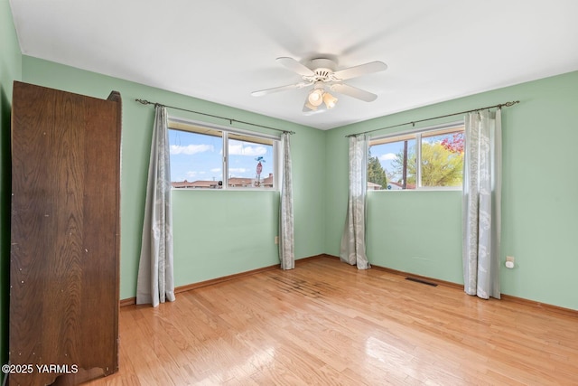 220 N 42nd Ave, Yakima, WA 98908 - empty room featuring ceiling fan, baseboards, wood finished floors, and visible vents