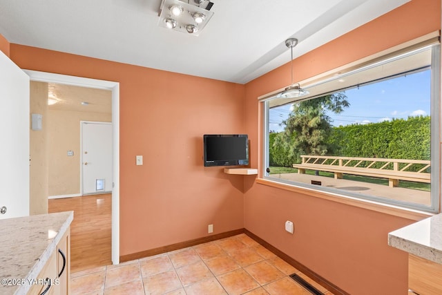 220 N 42nd Ave, Yakima, WA 98908 - interior space with light stone counters, light tile patterned floors, pendant lighting, baseboards, and visible vents