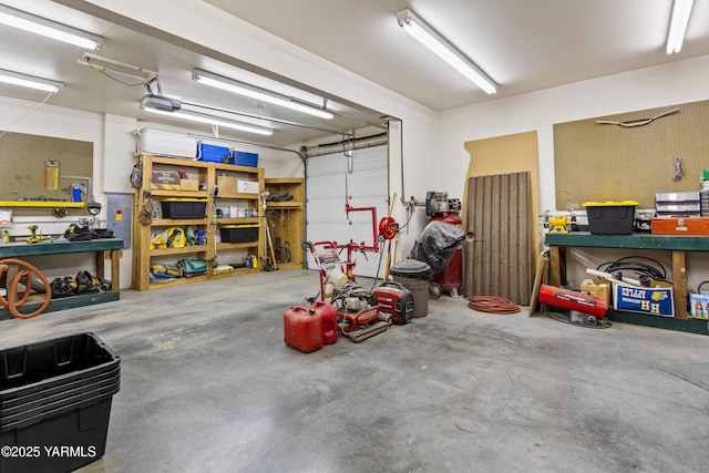 garage featuring a workshop area and a garage door opener