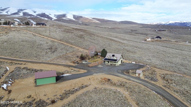 drone / aerial view with a rural view and a mountain view