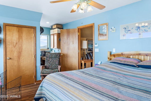 bedroom featuring wood finished floors and a ceiling fan