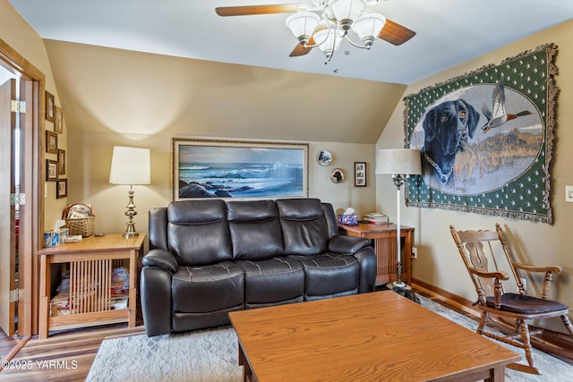 living area with vaulted ceiling, wood finished floors, a ceiling fan, and baseboards